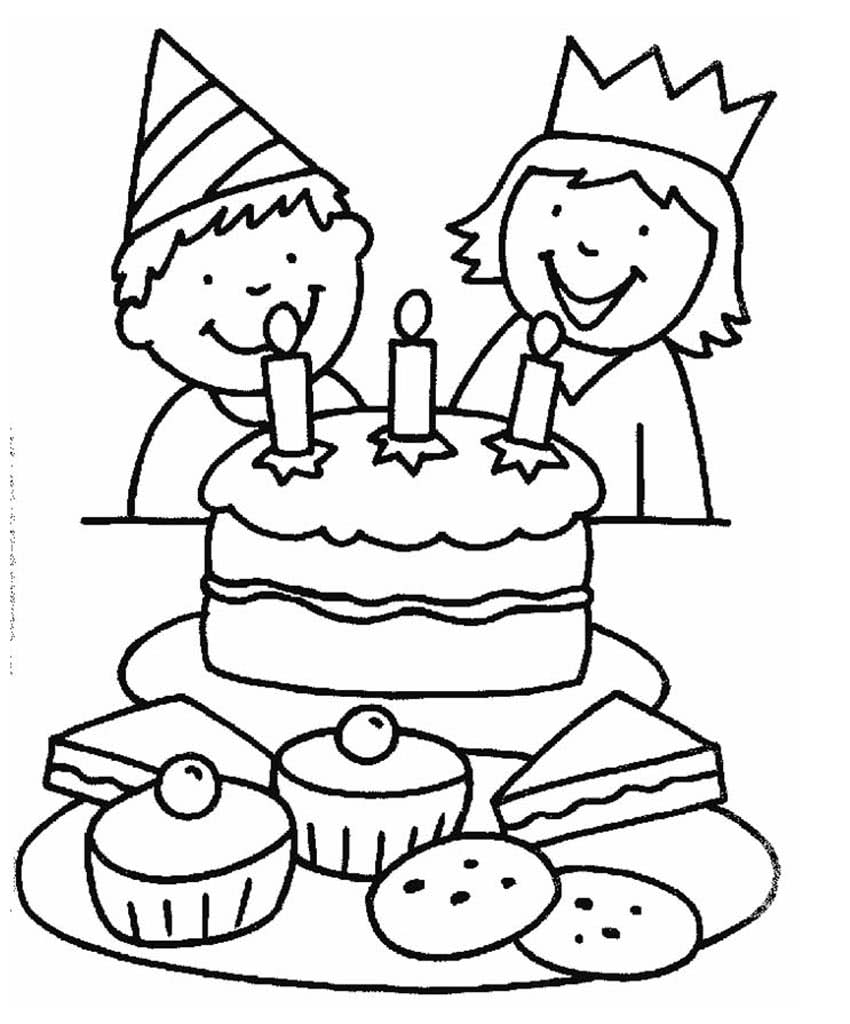 Мальчик и девочка за столом с тортом и сладостями