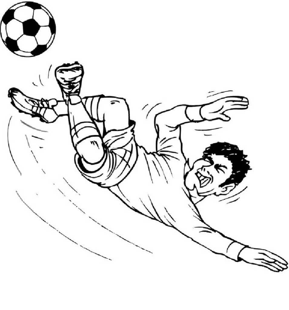 Футболист отбивает мяч ногой
