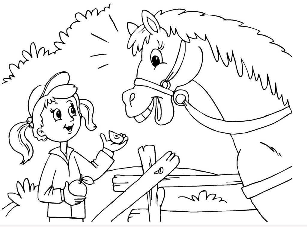 Девочка кормит лошадь яблоком
