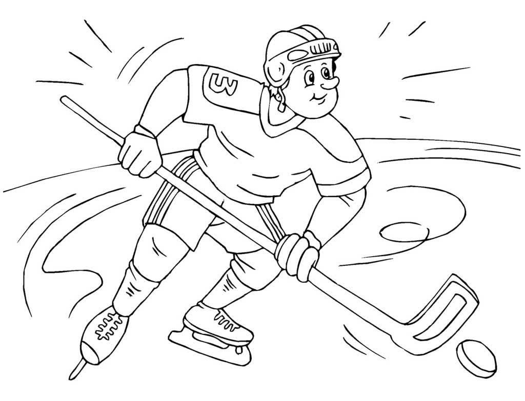Хоккеист с шайбой на льду
