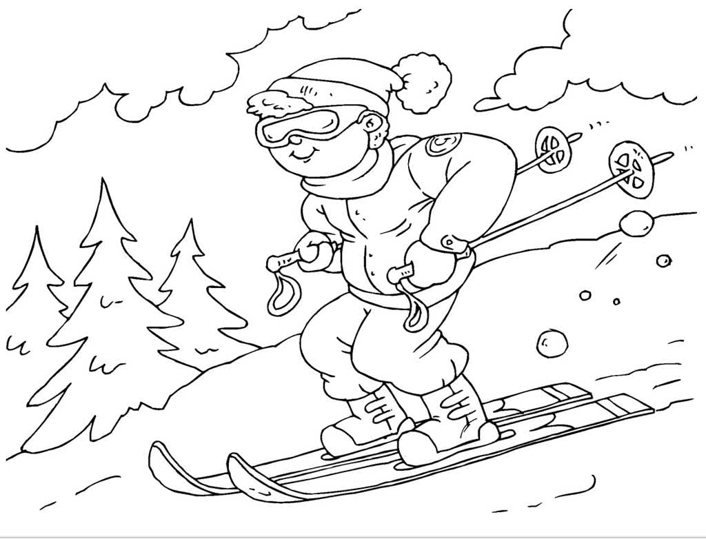 Мальчик на лыжах спускается с горы